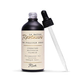 Open 100ml bottle of La Nature Restaure’s Follicle Serum Rich Formula